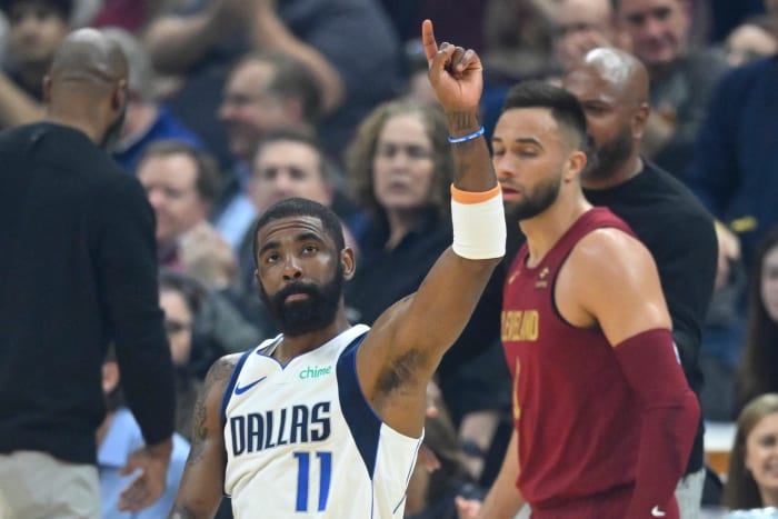 Feb 27, 2024; Cleveland, Ohio, USA; Dallas Mavericks guard Kyrie Irving (11) reacts to fans in the first quarter against the Cleveland Cavaliers at Rocket Mortgage FieldHouse.